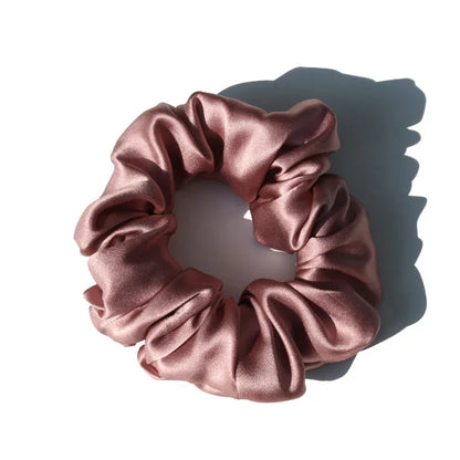 Emerald green large mulberry silk scrunchie with a rich, luxurious finish. Soft silk hair tie for a bold and stylish hair accessory.