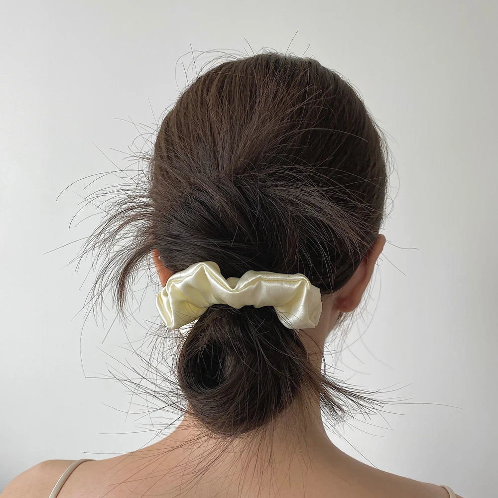 Blush pink large mulberry silk scrunchie with dimensions 3.5cm/1.4in width and 10cm/3.9in diameter. Soft, smooth silk hair tie for gentle styling.