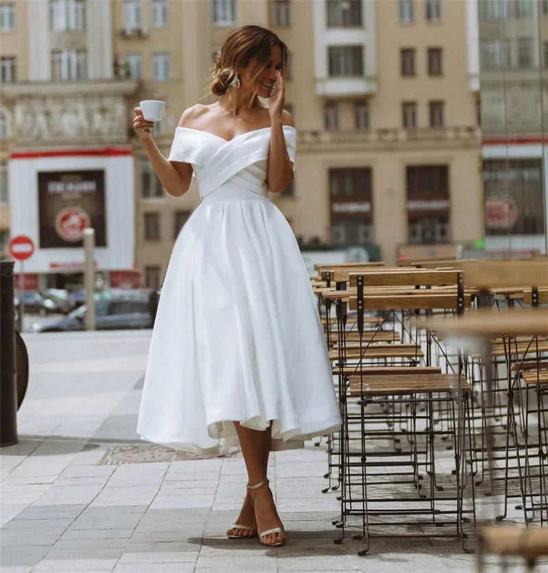 Elegant Off-The-Shoulder White Midi Dress –