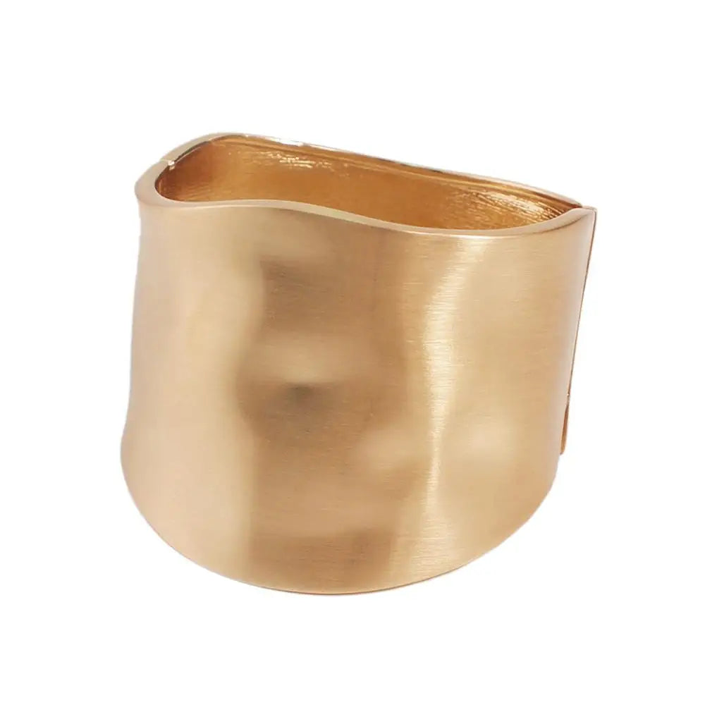 Gold-tone Sunset Gleam Hair Cuff featuring a smooth, wide cuff design with a subtle wave pattern for an elegant look.