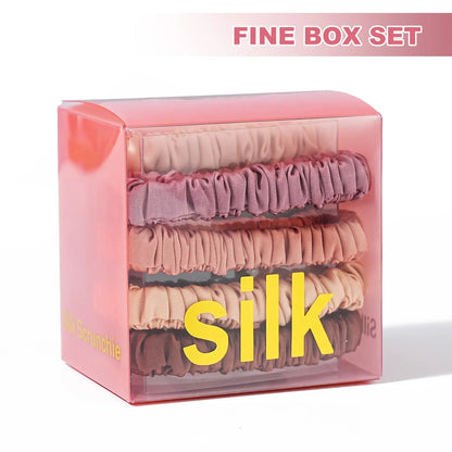 Fine box set of Mulberry Silk Hair Elastics in eight assorted colors. Ideal for gifting and protecting textured hair from breakage.