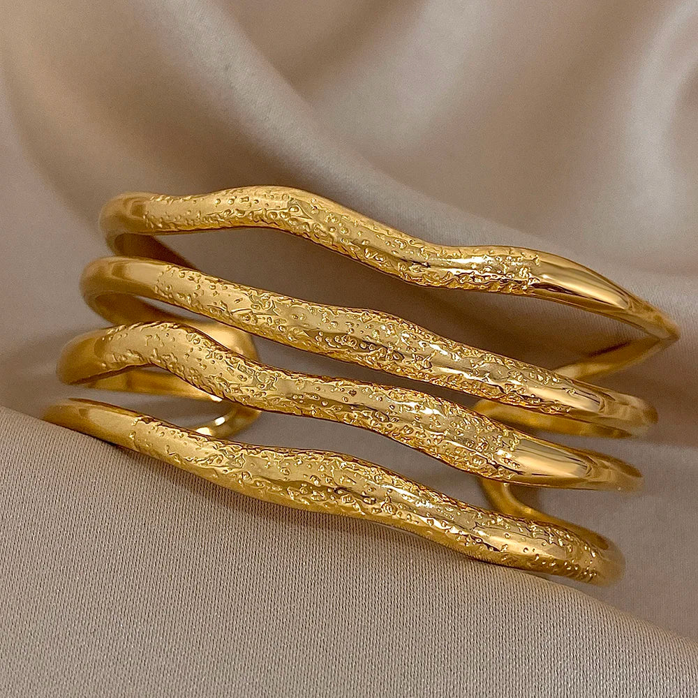 Multilayer Wave Cuff Bracelet on an brown cover