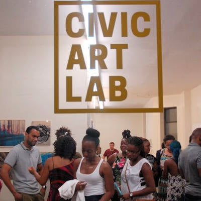 Visitors at BAD Hair Uprooted Exhibition in Bedstuy Brooklyn New York.