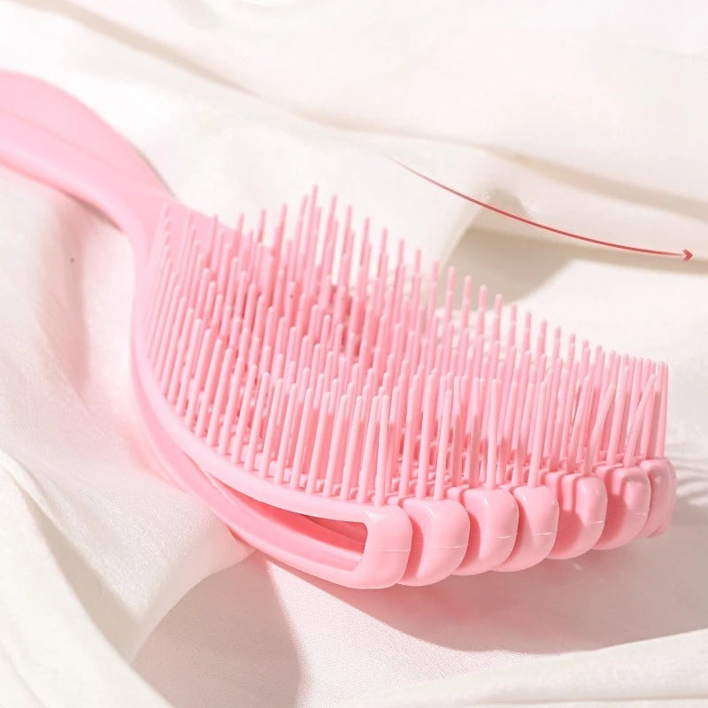 the pink shell shape detangling hair brush for Natural Hair and Locs. Painless 