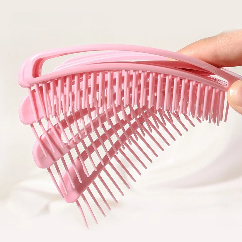 the pink shell detangling brush made out of 3 combs 