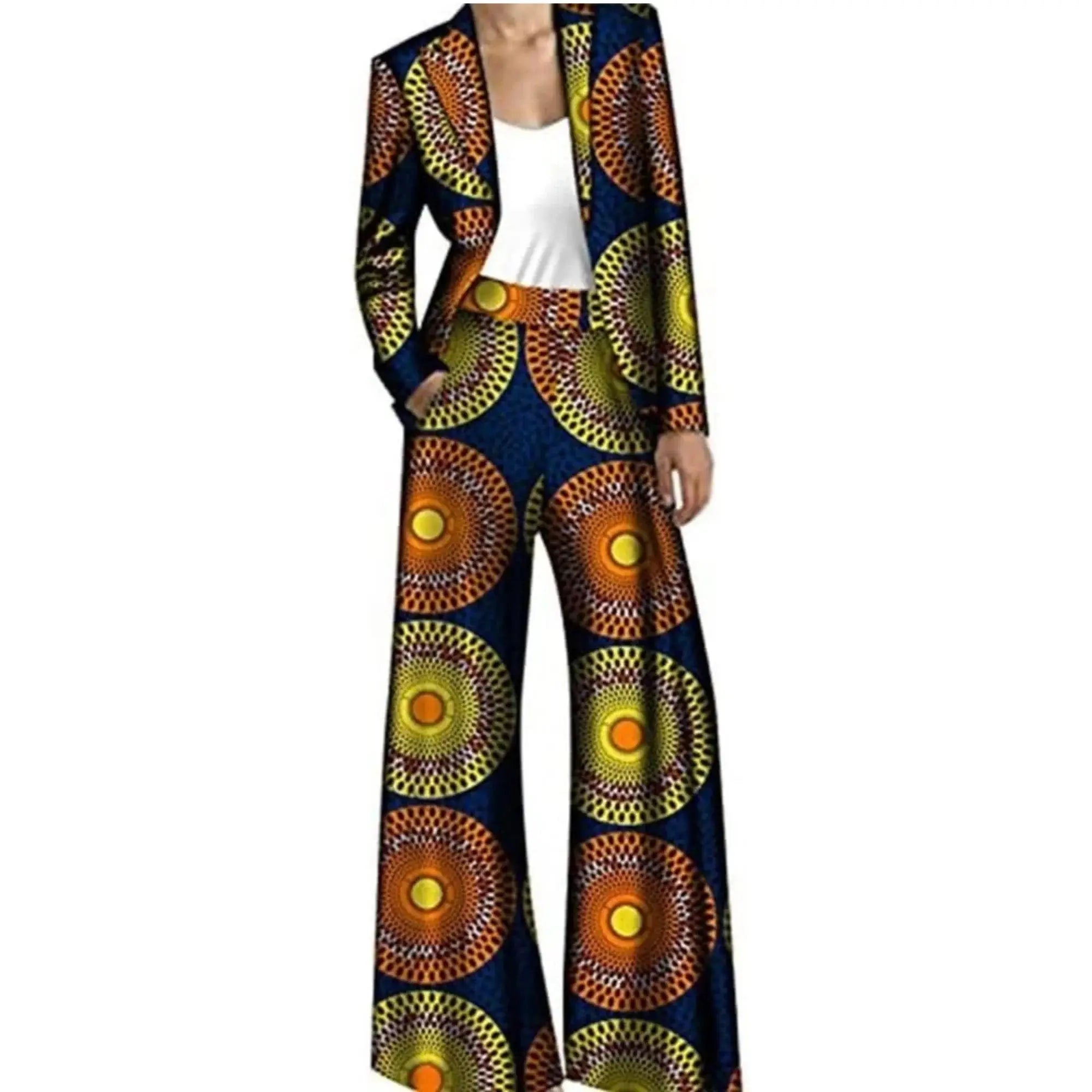 Navy blue African pantsuit with large circular yellow and orange patterns, including a structured jacket and wide-leg trousers. A unique look.