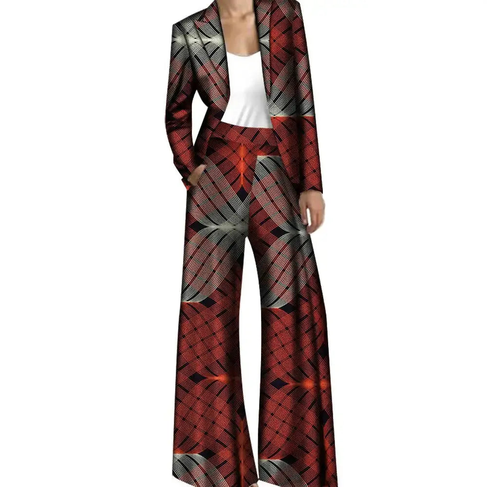 African pantsuit for women with a red and black geometric design. Includes a fitted jacket and wide-leg trousers in breathable cotton fabric.