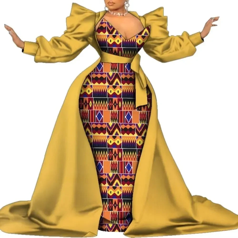 Gold satin overlay gown with a geometric kente-style print panel and puff sleeves, on a white background.