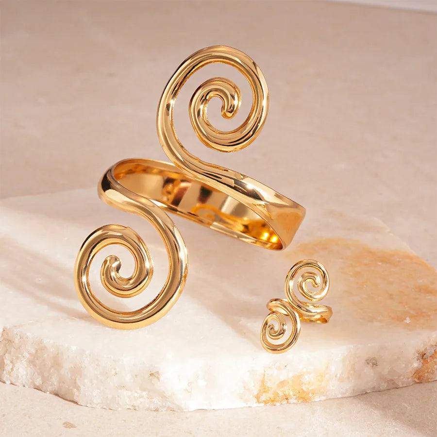 Polished gold spiral hair cuff and matching ring set product view.   