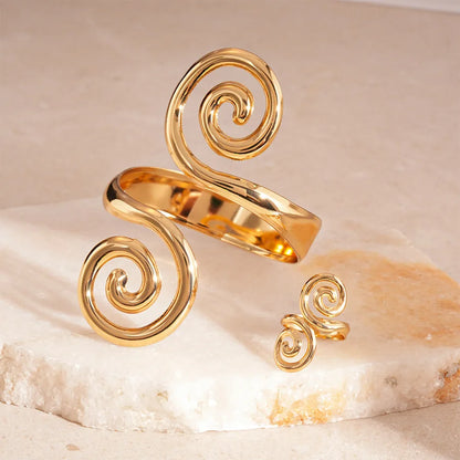 Polished gold spiral hair cuff and matching ring set product view.   