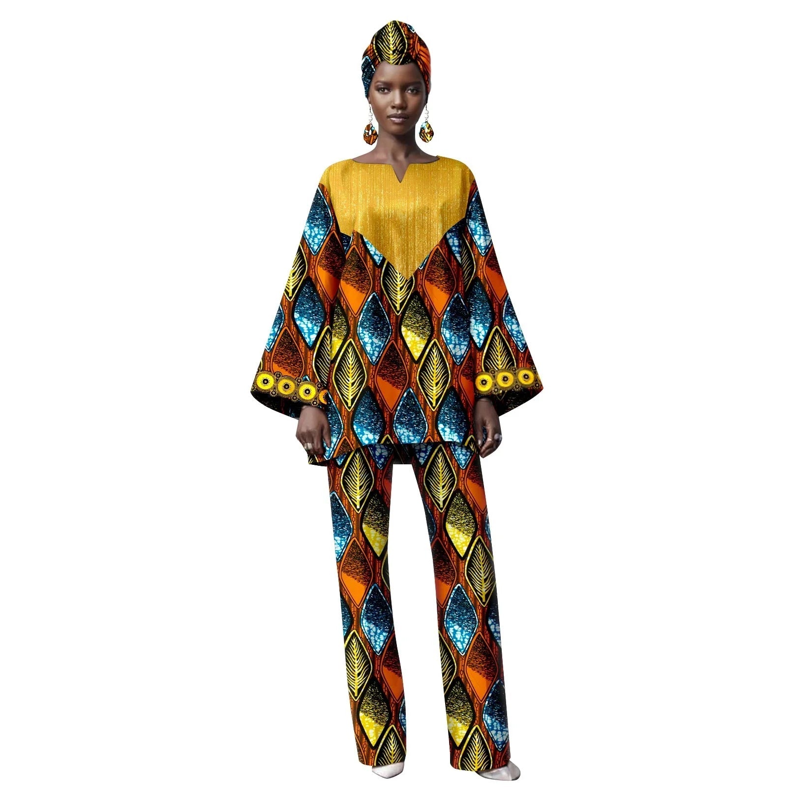 Woman wearing a colorful traditional outfit with a patterned top and pants on a white background.
