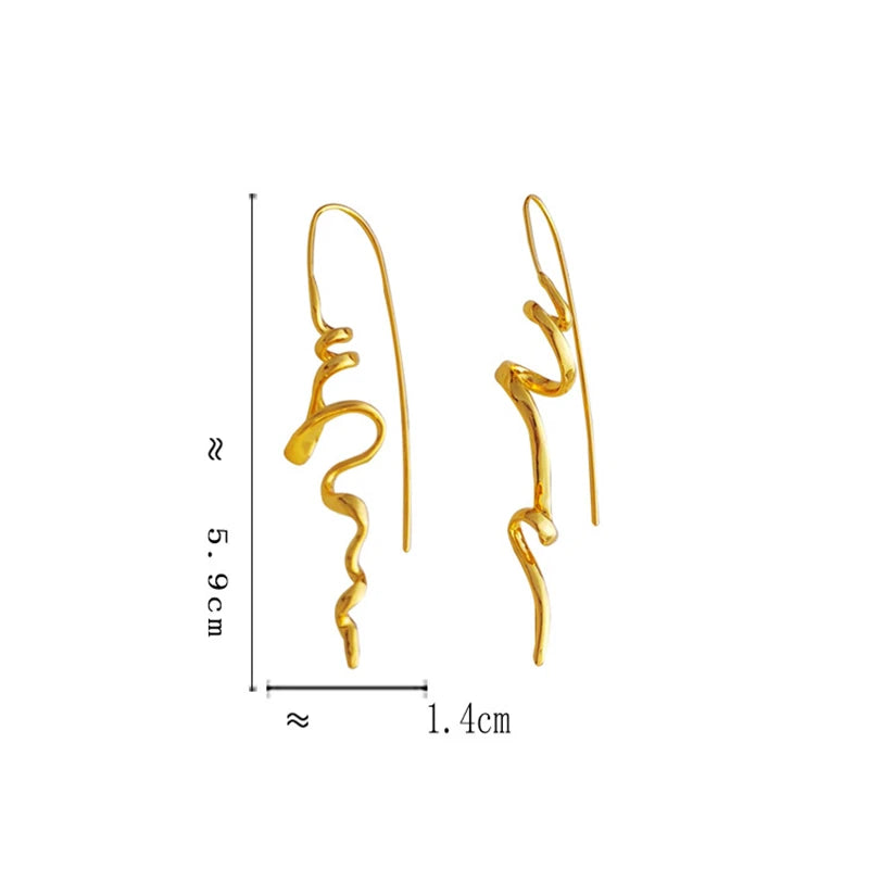 Gold abstract wavy drop earrings shown with dimension markings indicating a height of approximately 5.9 cm, width of 1.