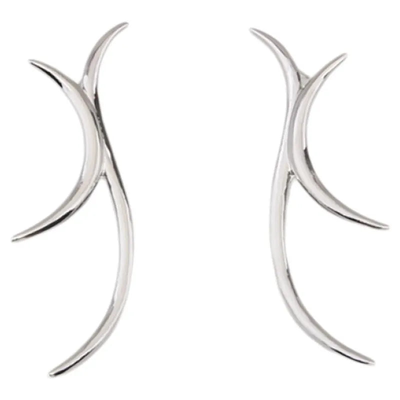 Sculptural silver antler-inspired earrings close-up