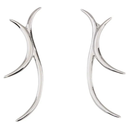 Sculptural silver antler-inspired earrings close-up