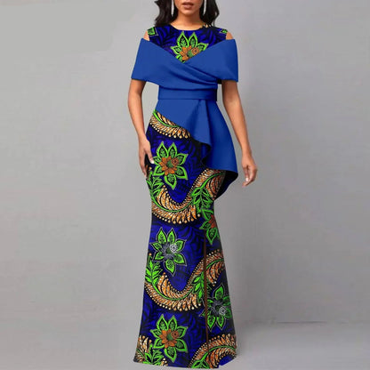 Woman wearing a blue and green patterned dress with &