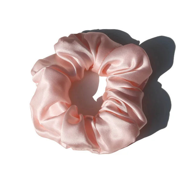 Lavender purple large mulberry silk scrunchie with a smooth, glossy finish. Elegant silk hair tie for a stylish and frizz-free hair hold.