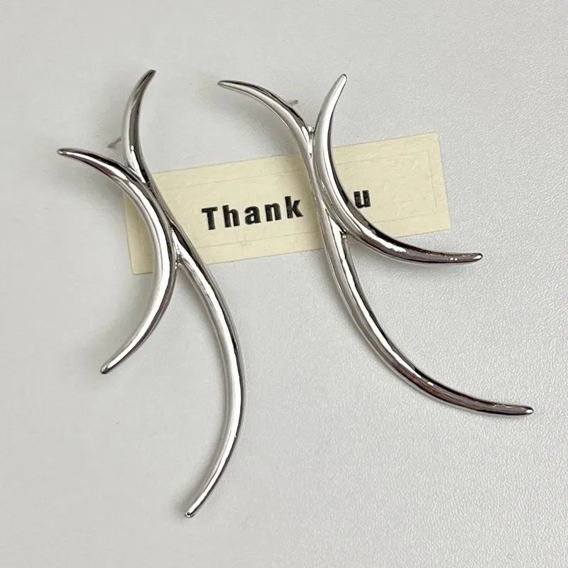Silver minimalist curved drop earring detail shot
