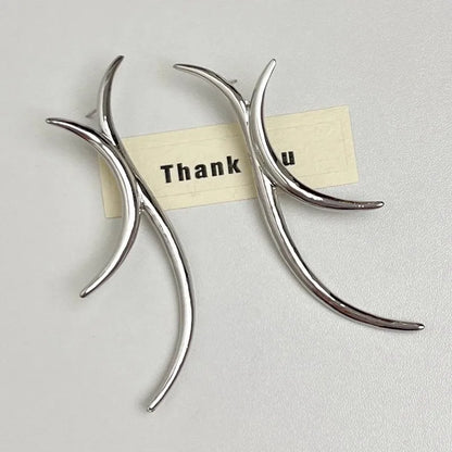 Silver minimalist curved drop earring detail shot