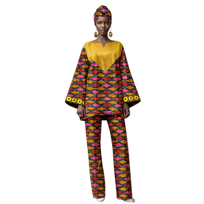Woman wearing a colorful patterned outfit with a yellow top on a white background
