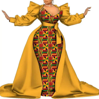 Yellow and patterned dress with long sleeves on a white background