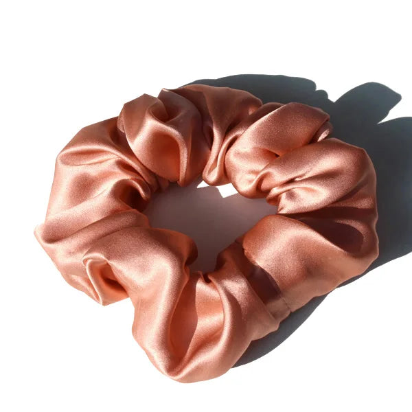 Golden yellow large mulberry silk scrunchie with a rich, luxurious finish. Soft silk hair tie for a bold and stylish hair accessory.