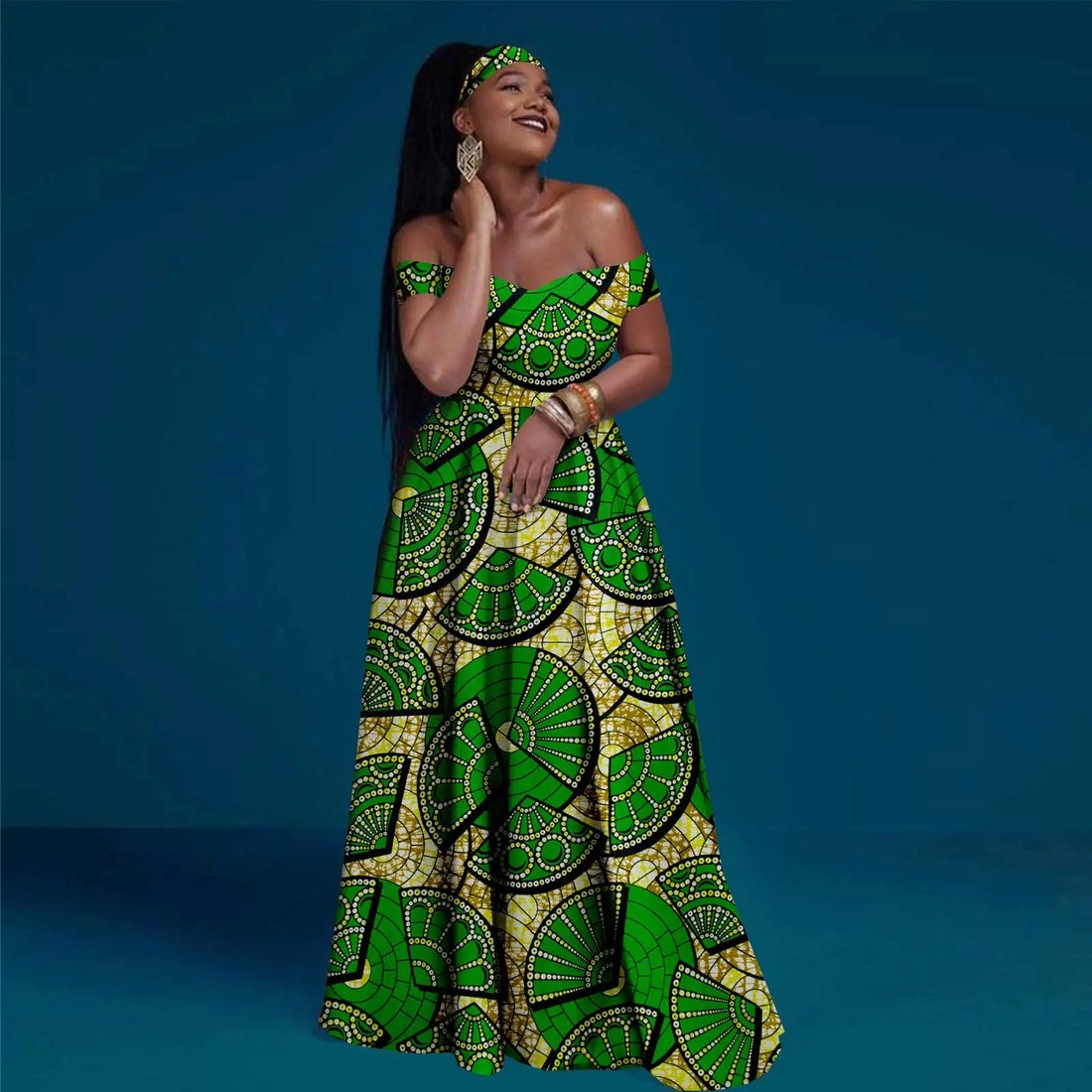Woman wearing a green and yellow patterned dress against a blue background