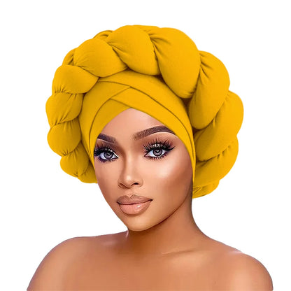 Woman wearing a yellow head wrap on a white background