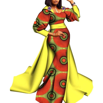 Colorful traditional outfit with geometric patterns on a white background, featuring the brand &