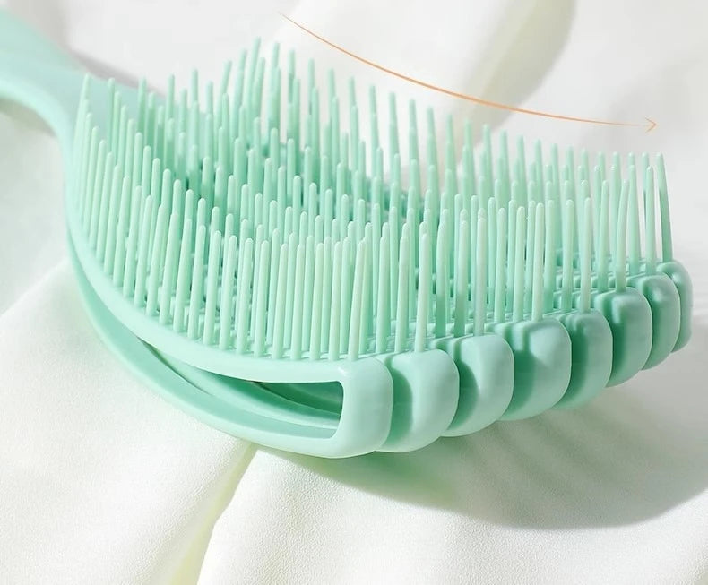 close up of the green shell detangling brush with white background