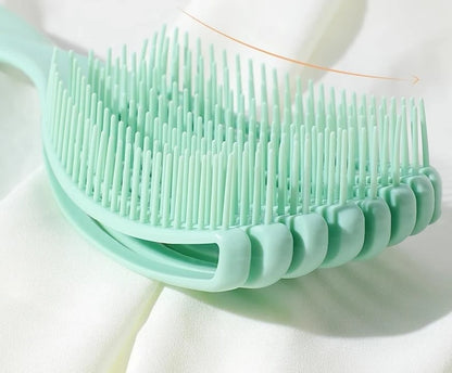 close up of the green shell detangling brush with white background
