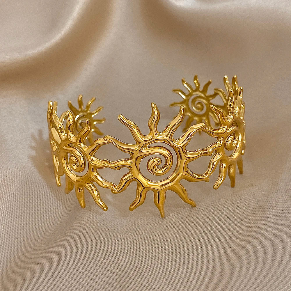 The Gold Spiral Hair Cuff on an brown background