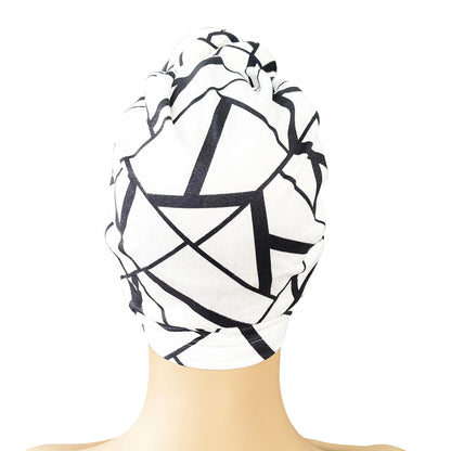 Back view of a black and white geometric patterned knot turban headwrap. Soft, breathable fabric with a stylish and secure fit for all-day wear.