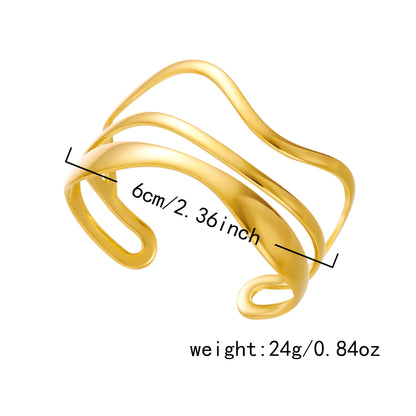 Gold cuff bracelet with measurements 6cm / 2.36 inch and weight 24g displayed on image.