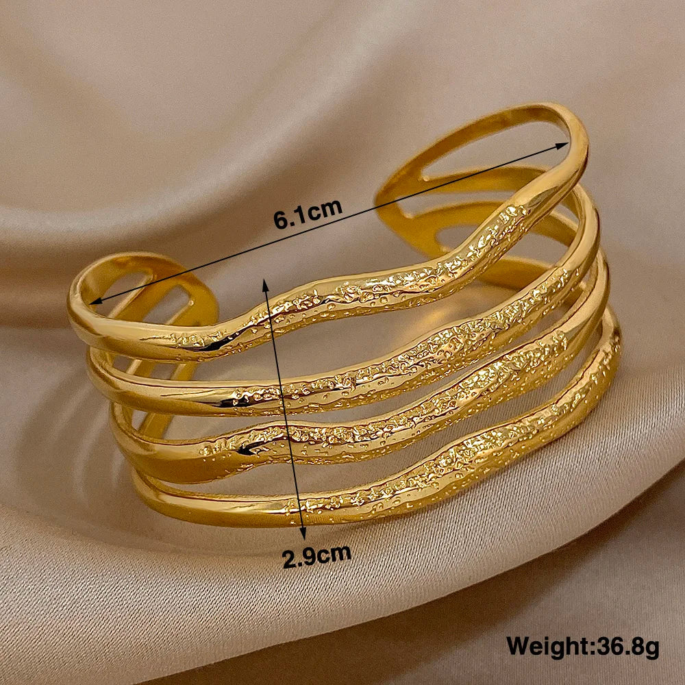 Wavy Sculpted Multi-Band Gold Bracelet weights 36.8g, 2.9 cm long and 6.1  in width