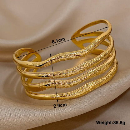 Wavy Sculpted Multi-Band Gold Bracelet weights 36.8g, 2.9 cm long and 6.1  in width