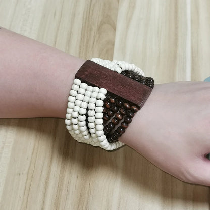 Wooden Bead Bracelet in Brown &amp; White on a wrist