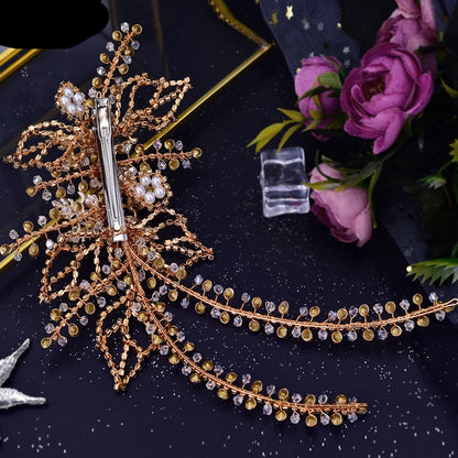 Back view of gold bridal headpiece showing clip fastening and crystal vine structure