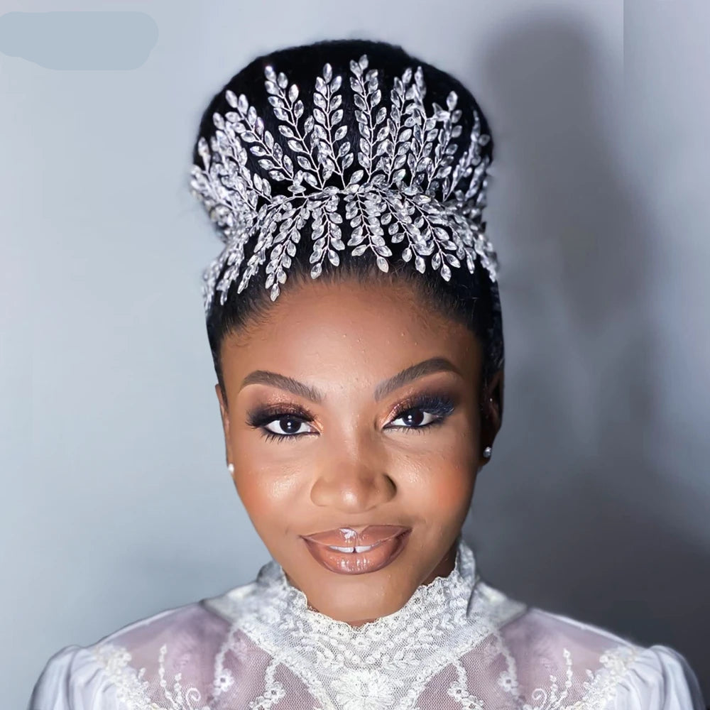 Bride wearing the silver boho bridal crown tiara styled on a high bun hairstyle