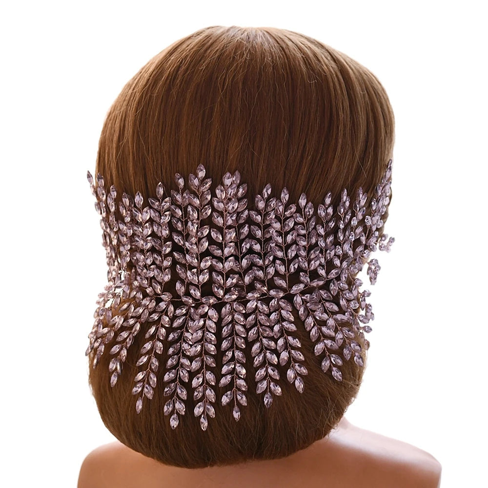 Bride wearing pink leaf bridal tiara styled at the back of an elegant updo