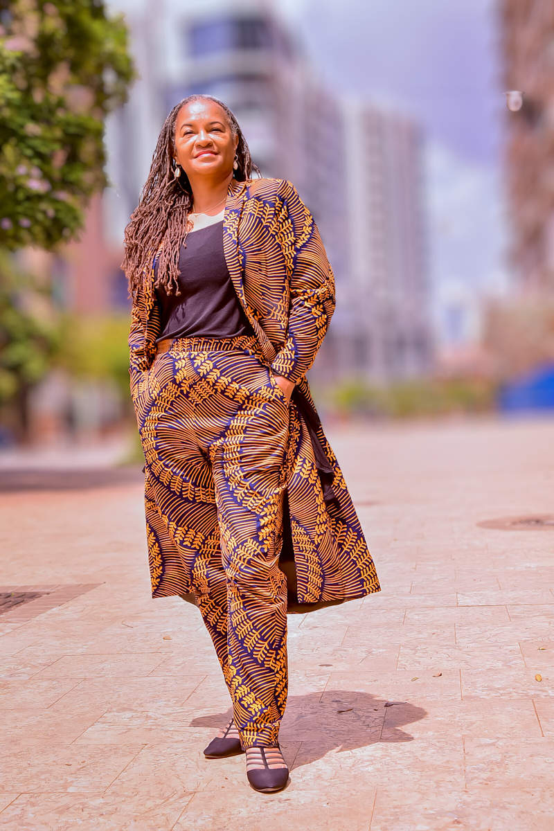 Mireille Liong-A-Kong with the orange  Kigali Signature 2-Piece Suit in medium 