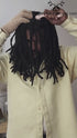 Man applying cryotherapy scalp roller to his locs, promoting blood circulation and soothing the scalp as part of the What Naturals Love Loc Care Bundle.