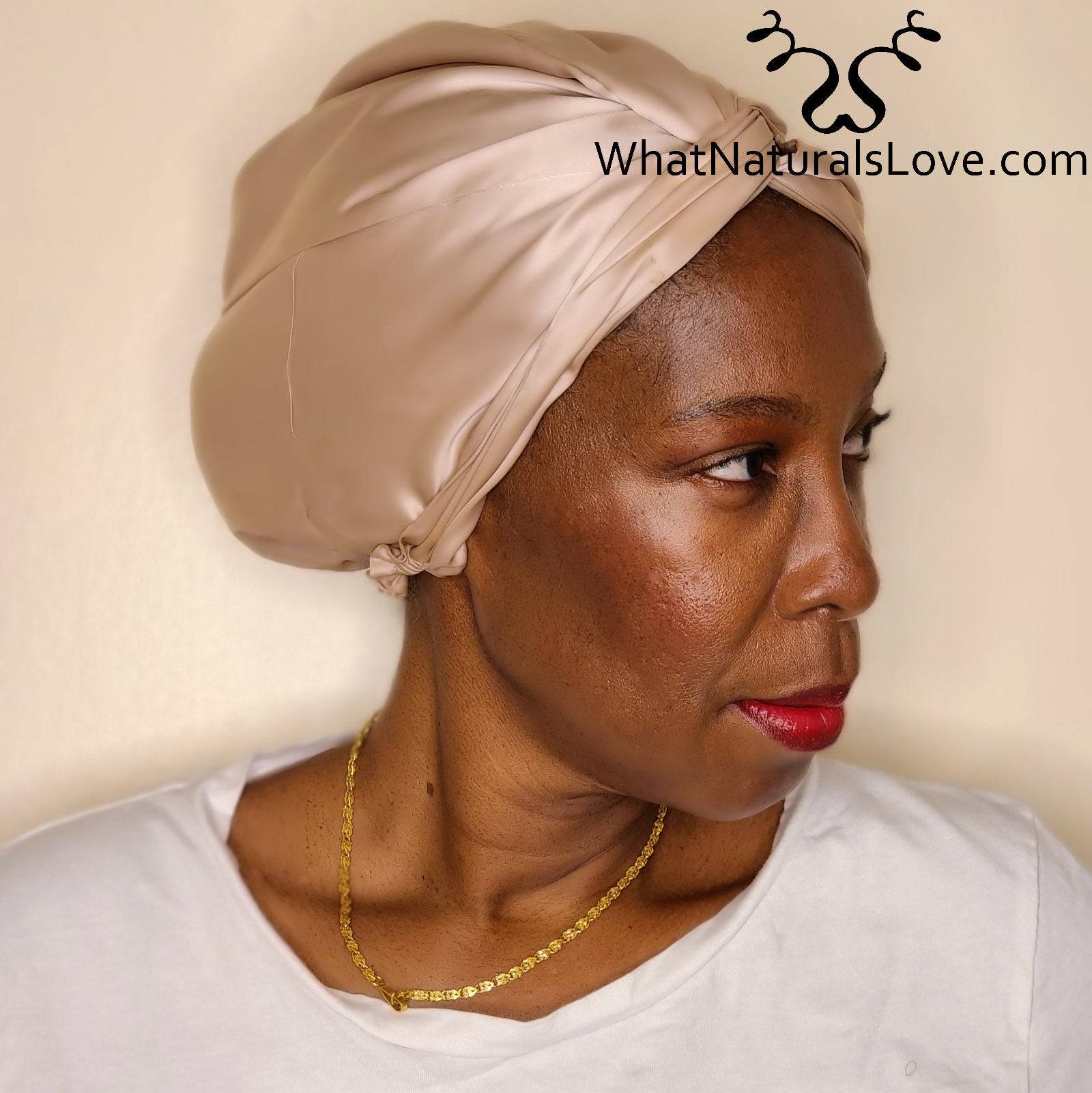 Woman wearing a beige 100% silk bonnet from the Starter Locs Package. Designed to protect locs and retain moisture while sleeping.