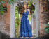 Elegant blue batik print maxi dress with pockets and belted waist, perfect for all sizes. A stylish boho sundress for casual and resort wear.